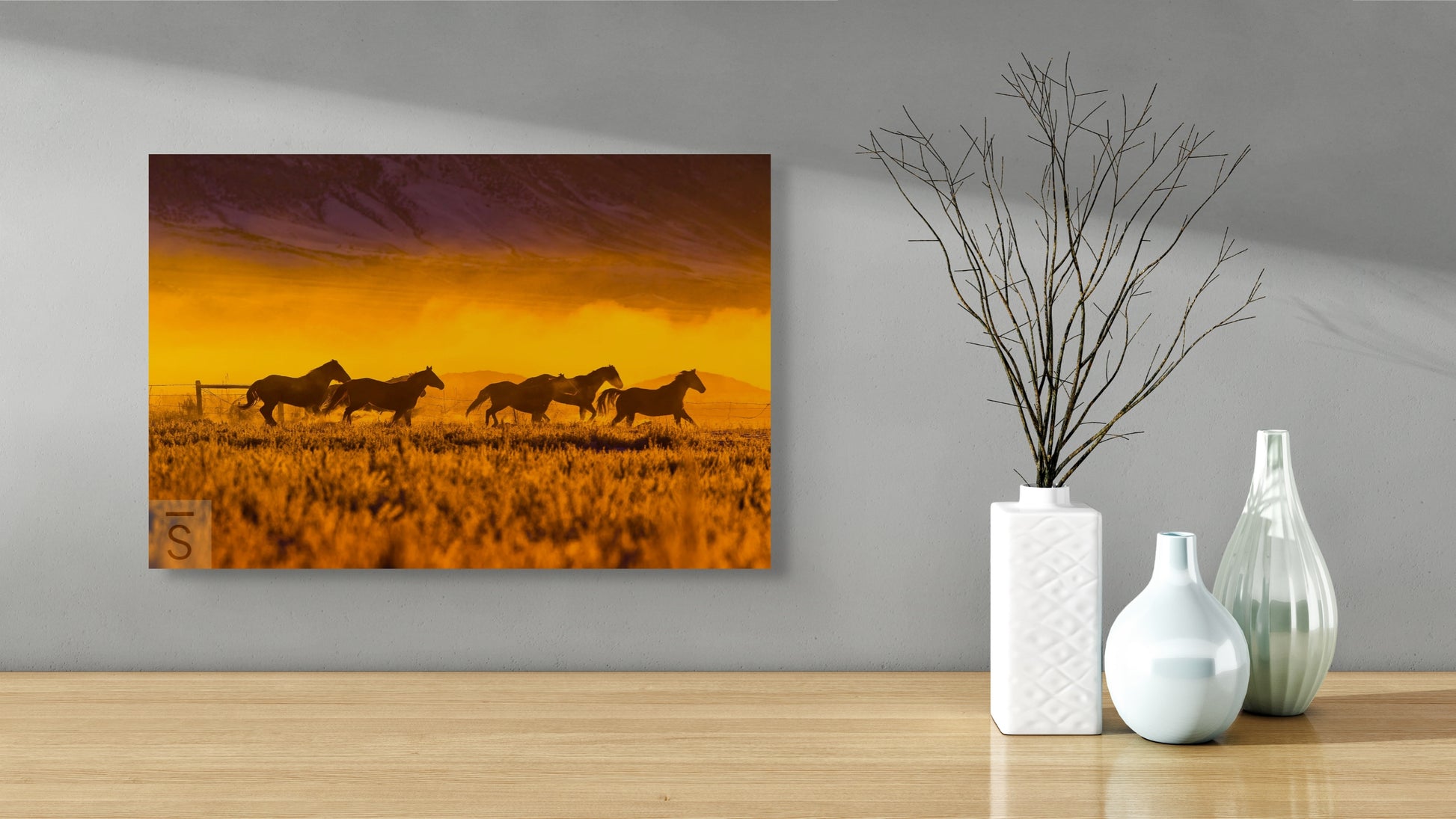 Horses run in a winter scene at a ranch in Idaho. Western fine art photography by David Stoecklein