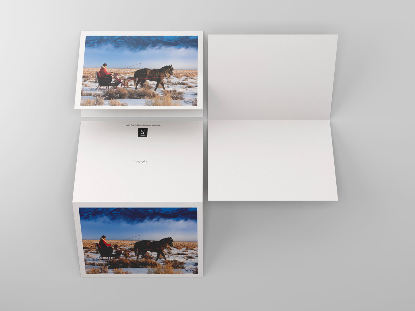 Christmas-themed note cards featuring the western fine art photography of David Stoecklein. Santa's winter sleigh is pulled by a team of horses.