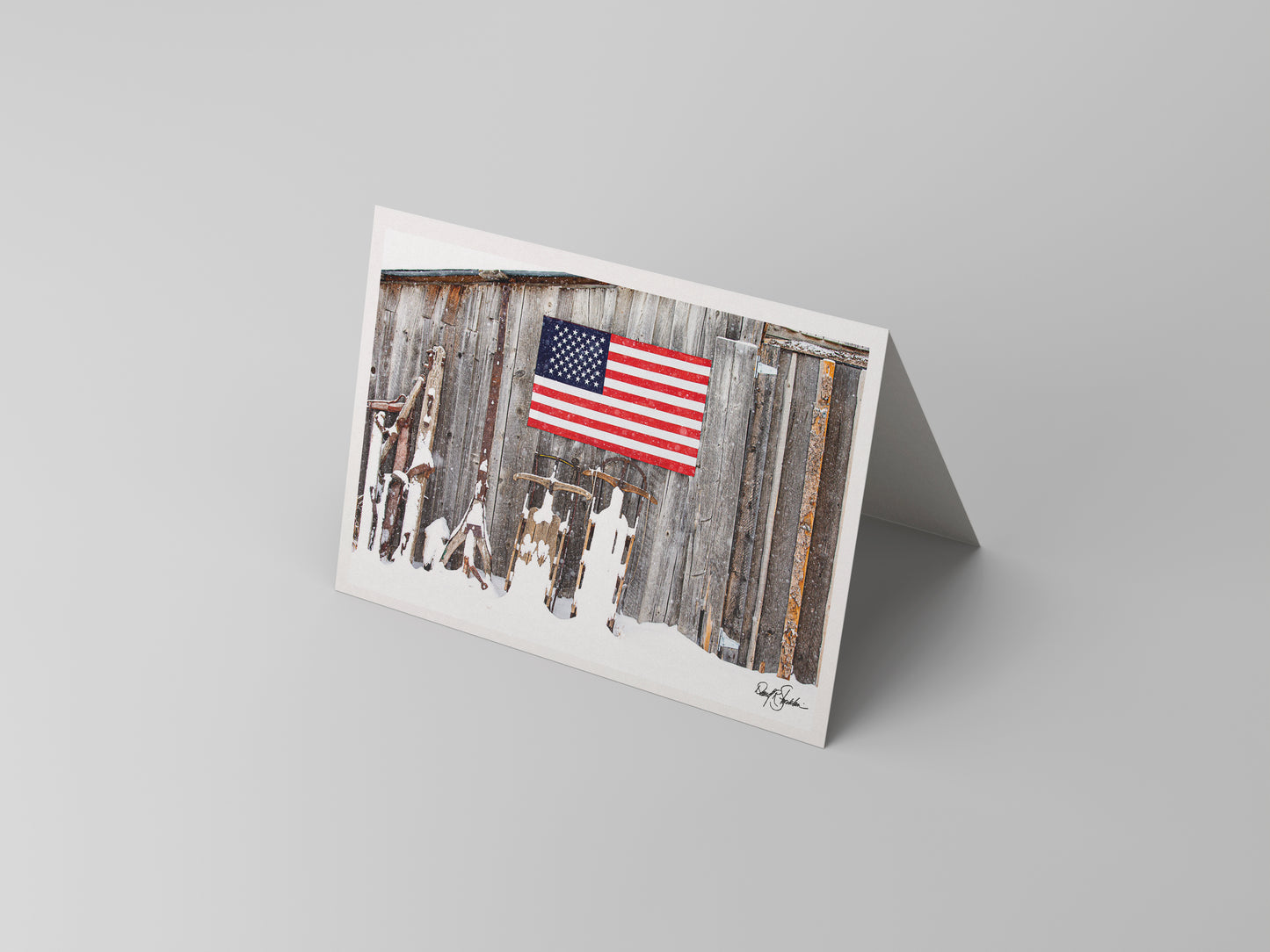 An American flag hangs in this western-themed notecard featuring fine art photography of David Stoecklein. 