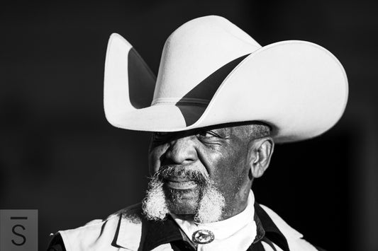 Black and white portrait of Texas Cowboy. Western fine art photography by David Stoecklein.