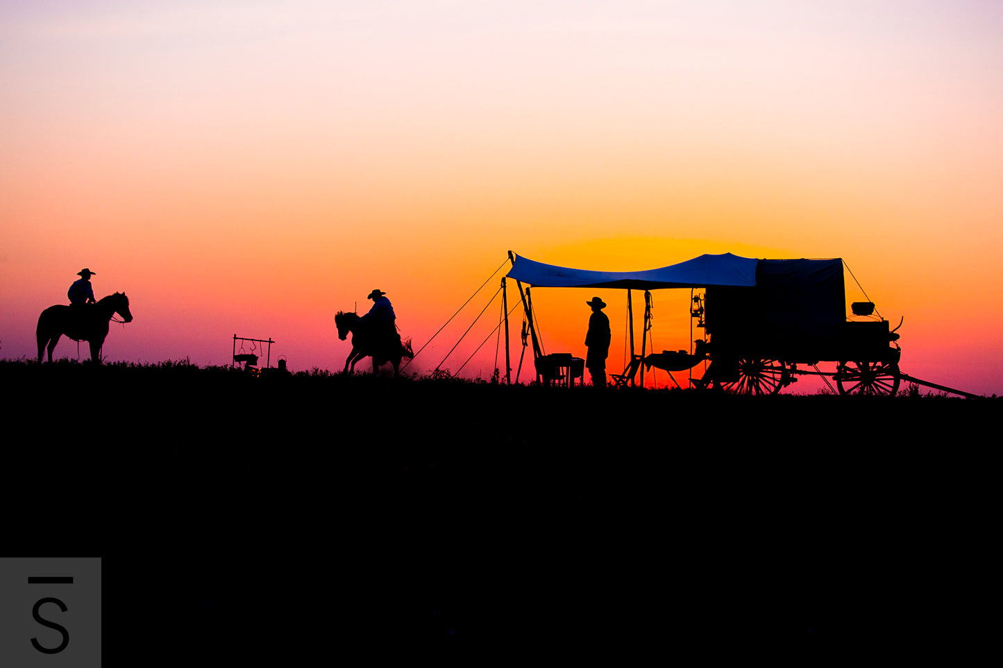 A bronc bucks at sunset. Western fine art photography by David Stoecklein.